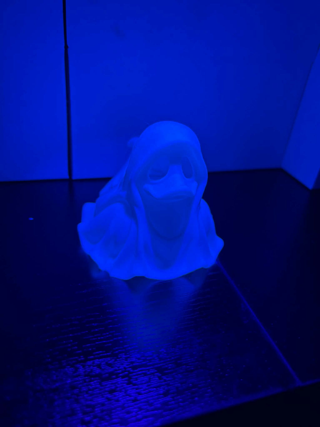 Ghost duckie glowing under light